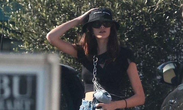 Paparazzi photograph — Kaia Gerber in a Brashy Studios bucket hat
